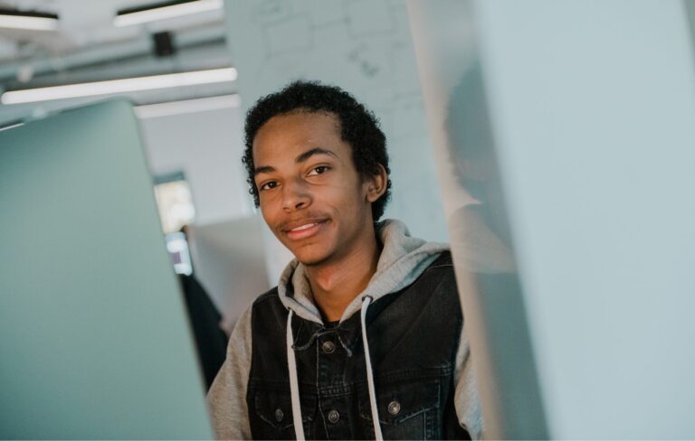 Student behind computer cluster v1